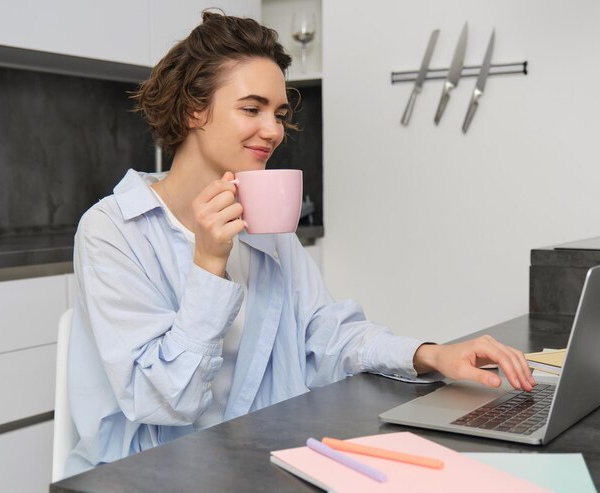 An employee having an engaging online coffee break with her team members