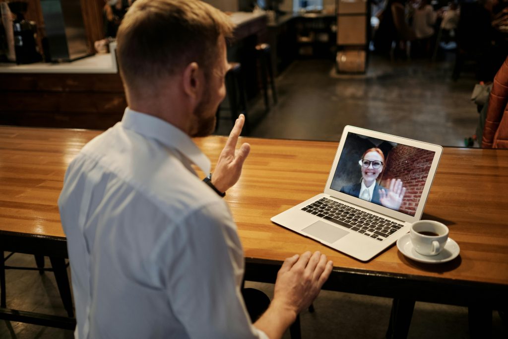 remote employee greets his coworker