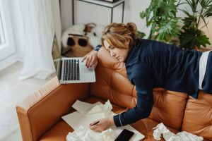 tired remote employee laying on the coach